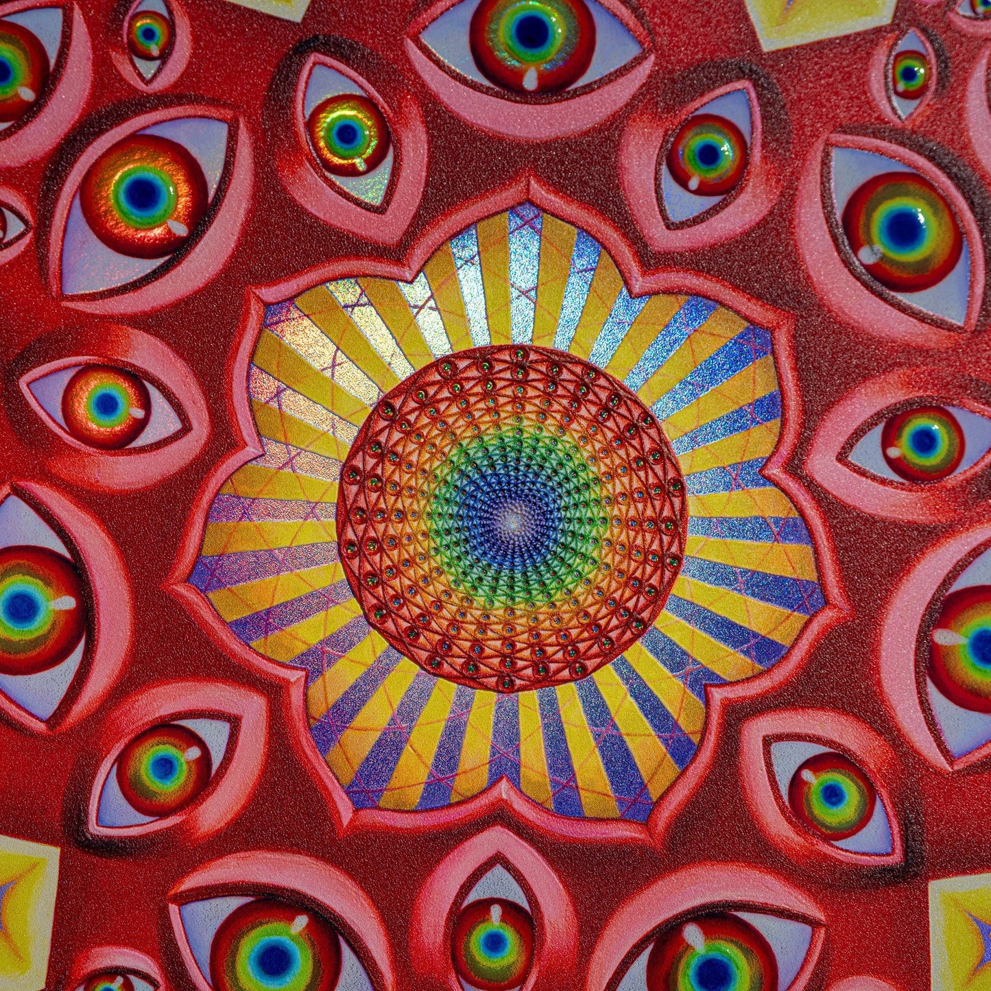 CoSM Shop Vision Crystal Tondo holographic textured metal print featuring a central mandala of eyes and radiating sun rays, surrounded by multiple eyes on a red textured background.