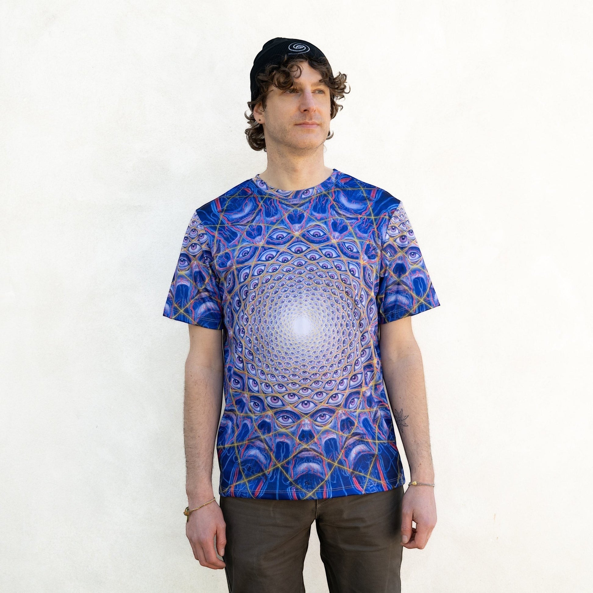 CoSM Shop blue all-over print dye-sub t-shirt with a mandala eye design, made of moisture-wicking polyester.