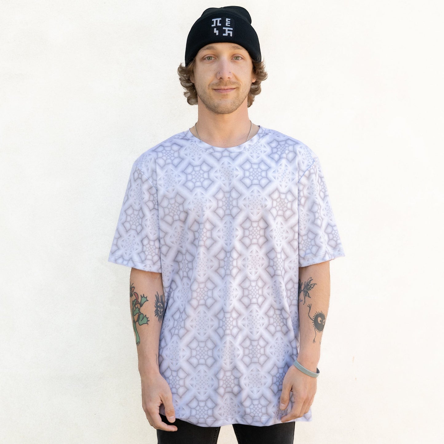 CoSM Shop men's all-over print dye-sub t-shirt in white and grey geometric pattern, made of moisture-wicking polyester.