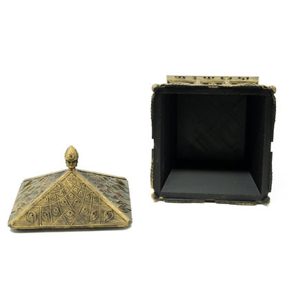 CoSM Shop Entheon Prayer Box, a hand-painted gold sculpture with intricate eye and leaf patterns, designed for creative manifestation prayers.