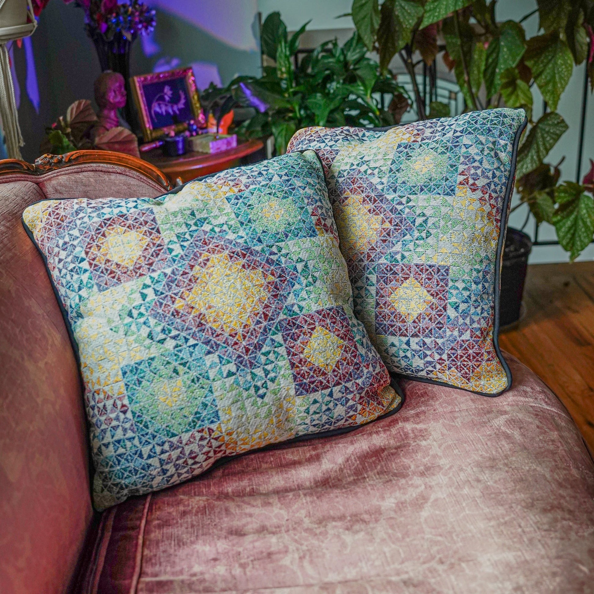 CoSM Shop Gems 3 woven pillow with a colorful geometric pattern in blue, yellow, and purple, made from recycled cotton.