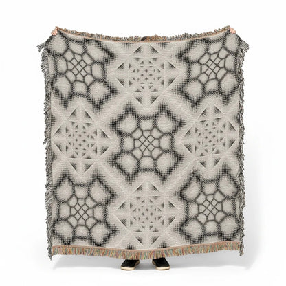 CoSM Shop Inkwash art blanket, 60"x60", woven 100% recycled cotton with a grey scale geometric pattern.