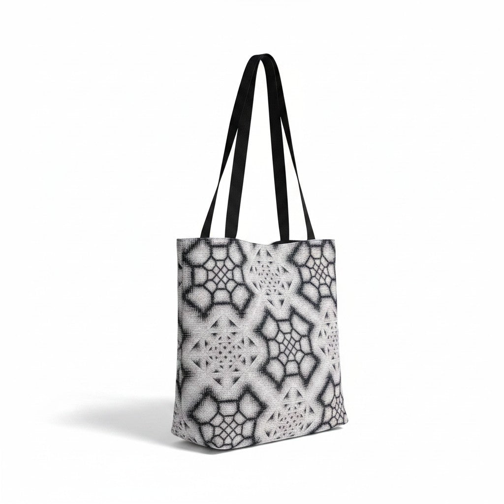 CoSM Shop Inkwash woven tote bag with black straps, featuring a grey and black geometric tapestry pattern.
