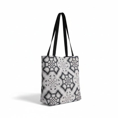 CoSM Shop Inkwash woven tote bag with black straps, featuring a grey and black geometric tapestry pattern.