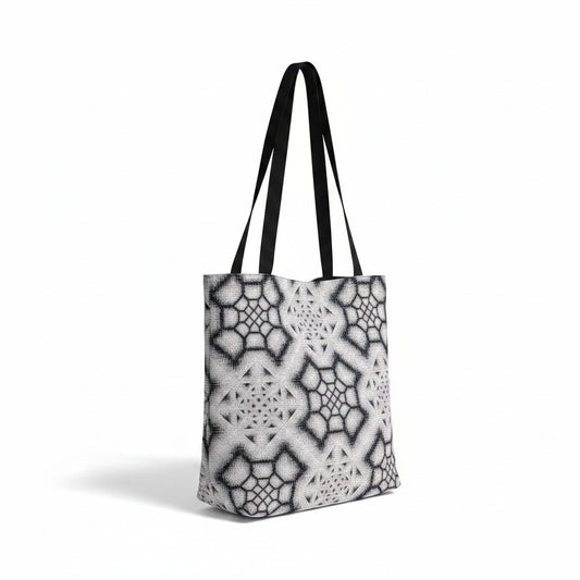 CoSM Shop Inkwash woven tote bag with black straps, featuring a grey and black geometric tapestry pattern.