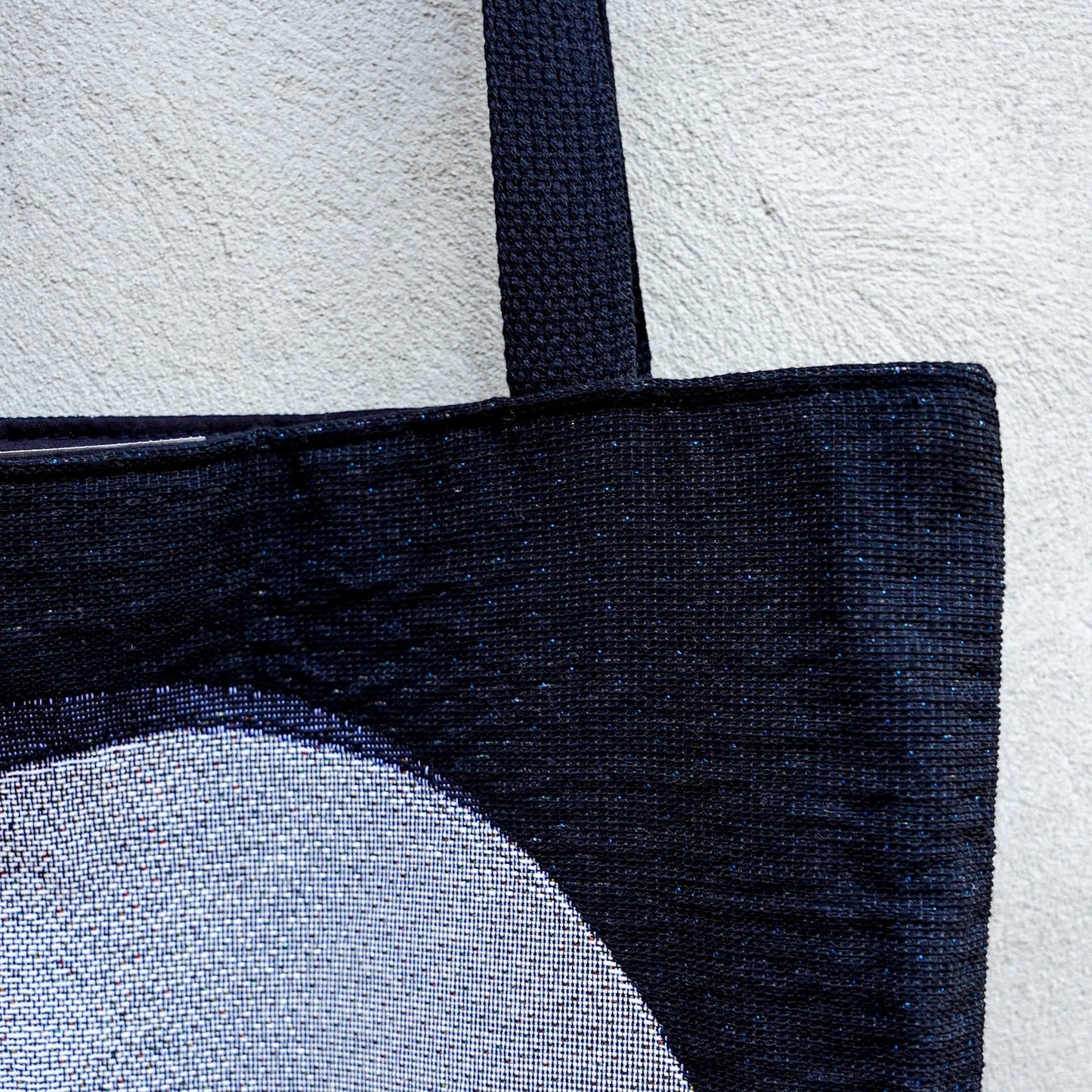 CoSM Shop Polar Unity Spiral woven tote bag with black canvas interior and strap, featuring Alex Grey artwork.