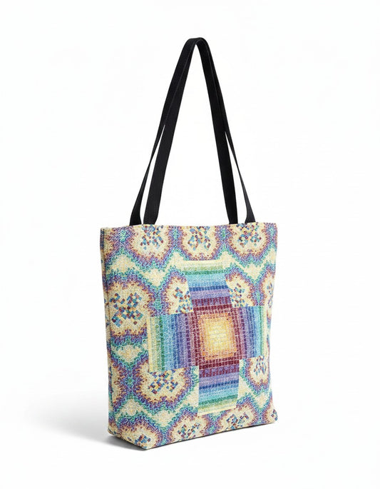 CoSM Shop Rainbow Cross woven tote bag with multicolor geometric pattern and black straps. 100% cotton.