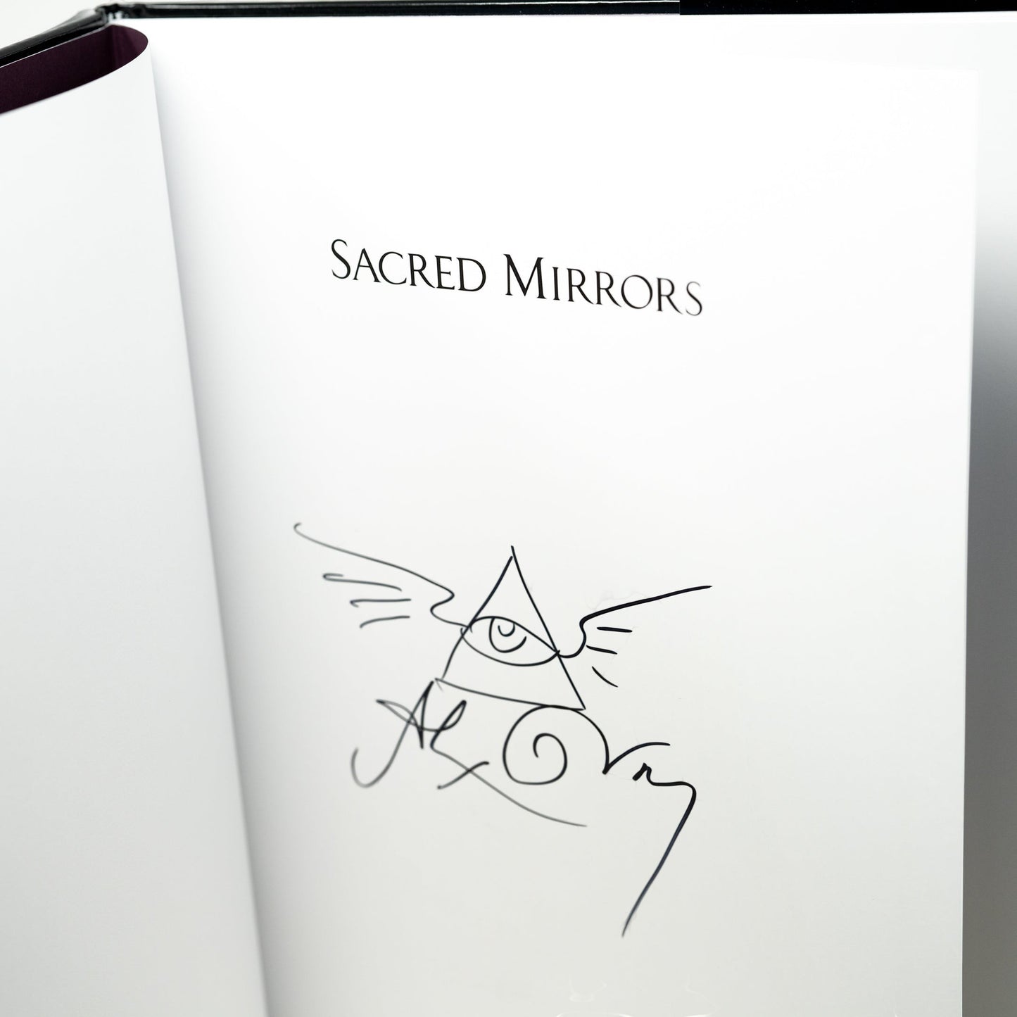 CoSM Shop Sacred Mirrors book with signature and eye of providence symbol. 100 pages, 50 color plates.