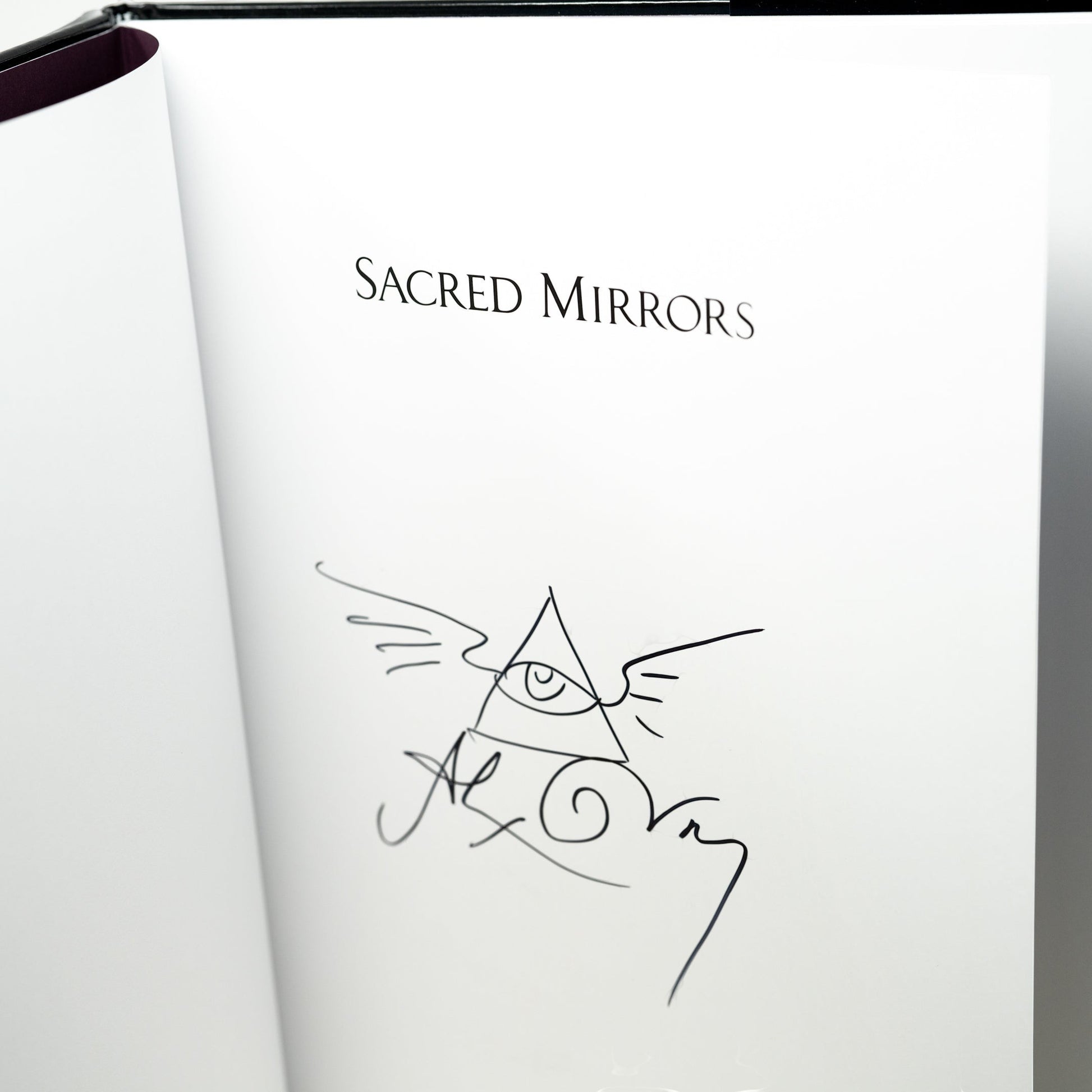 CoSM Shop Sacred Mirrors book with signature and eye of providence symbol. 100 pages, 50 color plates.