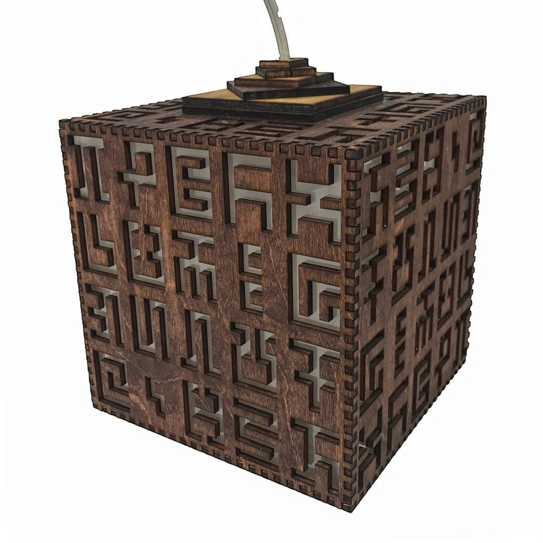 CoSM Shop Secret Writing hanging lamp, laser cut birch wood with abstract symbols, 8x8x8 inches.