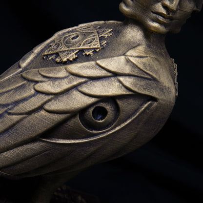 CoSM Shop Soulbird sculpture, hand-painted bronze finish, featuring intricate wing details and a unique eye motif.