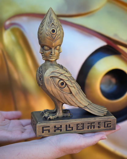 CoSM Shop Soulbird sculpture by Alex Grey, hand-painted gold bird with four faces and third eye, 10" limited edition