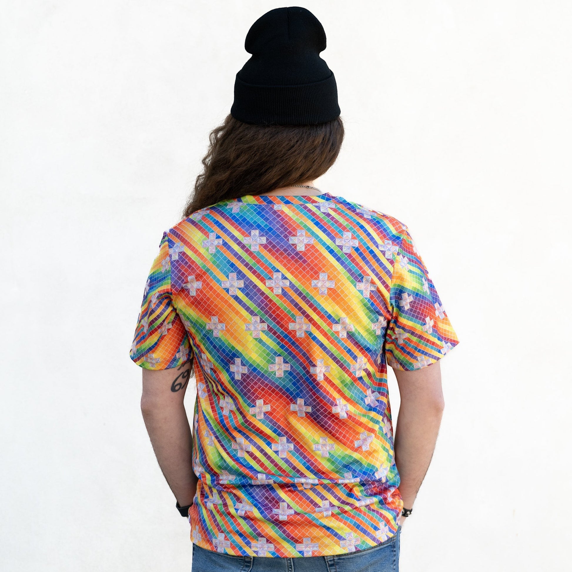 CoSM Shop men's short-sleeve dye-sub t-shirt with a rainbow spectral rain pattern and white cross accents. Made of polyester.