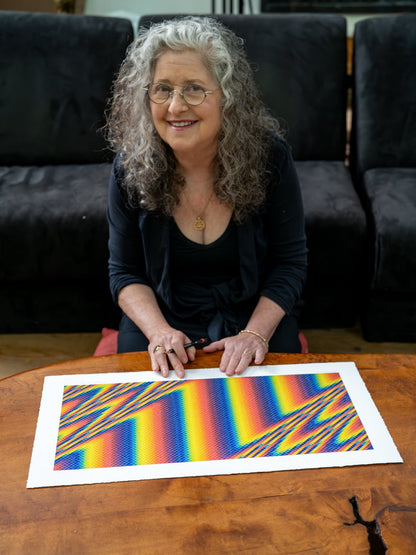 CoSM Shop Spectral Wave paper print by Allyson Grey, featuring a rainbow gradient with diagonal lines on archival matte paper.