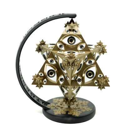 CoSM Shop Vision Crystal Prayer Wheel sculpture by Alex Grey, gold and white with all-seeing eyes, 9.5" tall.